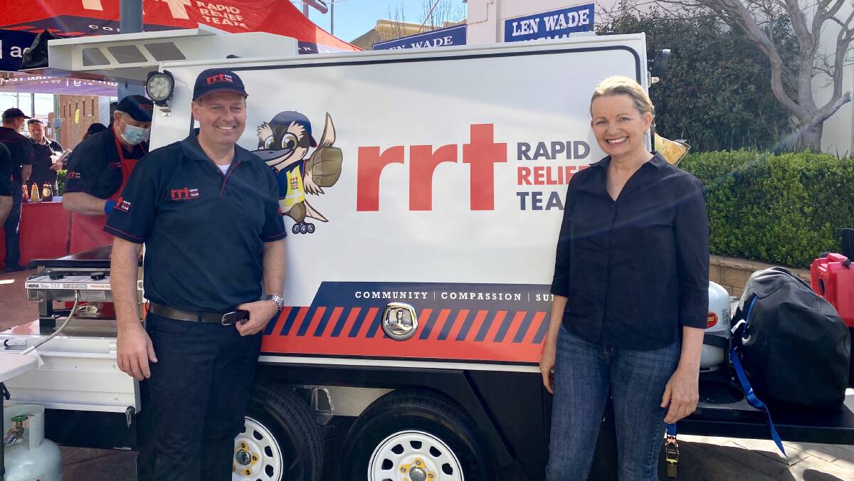 HARD AT WORK: Rod Martin from Leeton's Rapid Relief Team with Member for Farrer Sussan Ley at the recent fundraiser. 