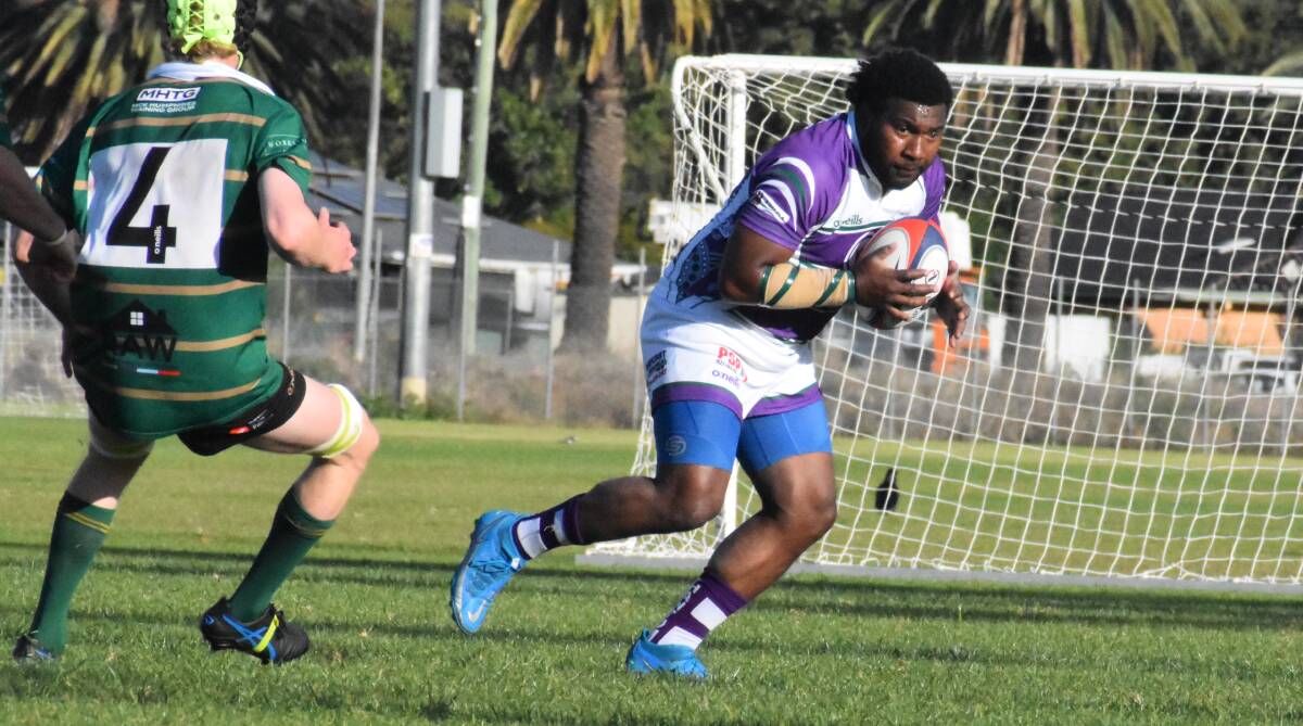 ON THE RUN: Miji Qaranivalu tries to evade the Ag College defence last weekend. The Phantoms will travel to Tumut on Saturday where they hope to pick up their first win of the season. Photo: Liam Warren