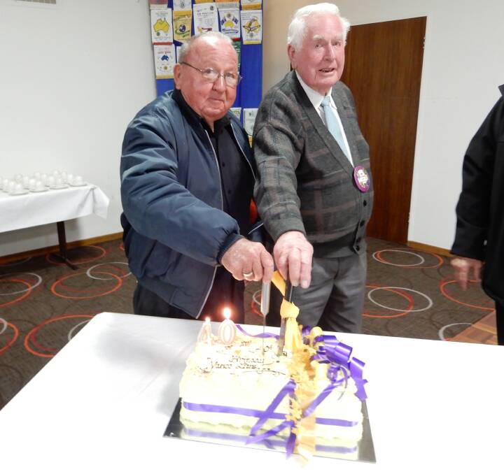 HUGE EFFORT: Max Preston (left) and Bob Payne were original charter members of the Yanco Lions Club and were on hand to cut the 40th anniversary cake.