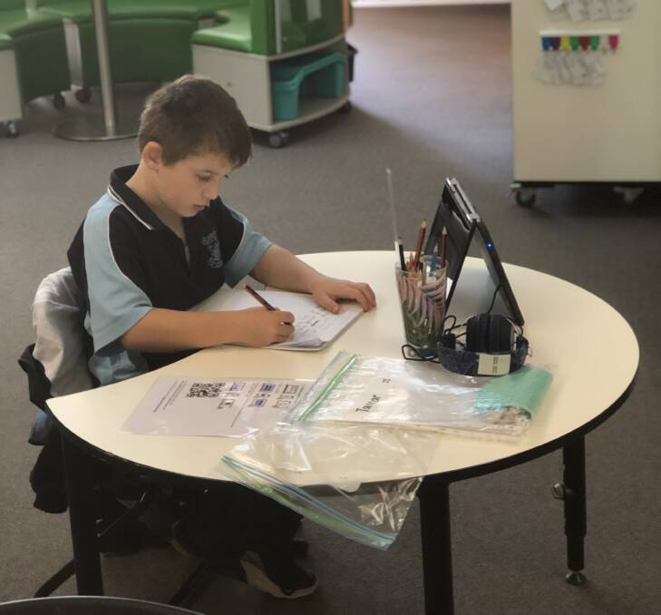 BACK ON DECK: St Joseph's Primary School student Tannar enjoys being back in the classroom environment this week. 