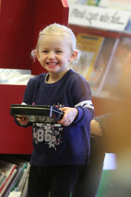 HAPPY: Young Ellie Seery, 2, is clearing enjoying storytime at the library last week. Photo: Talia Pattison 