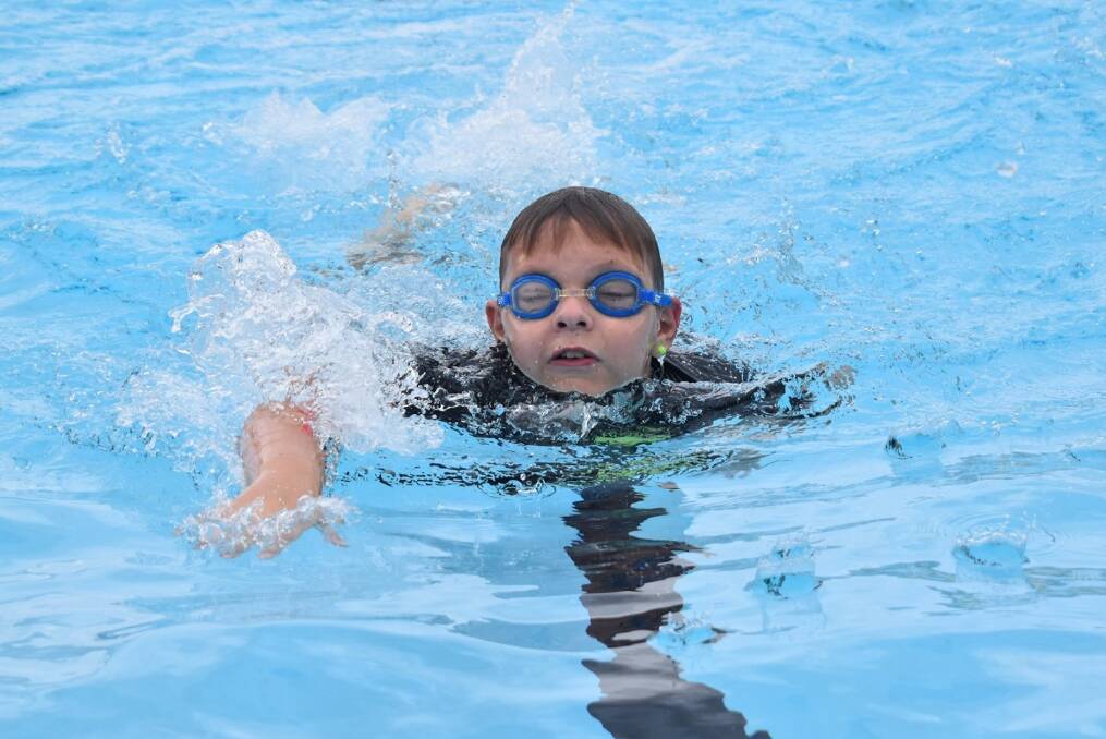 SWIM FAST: Wamoon Public School's Byron Cottom races to the finish during his race. Photo: Contributed 