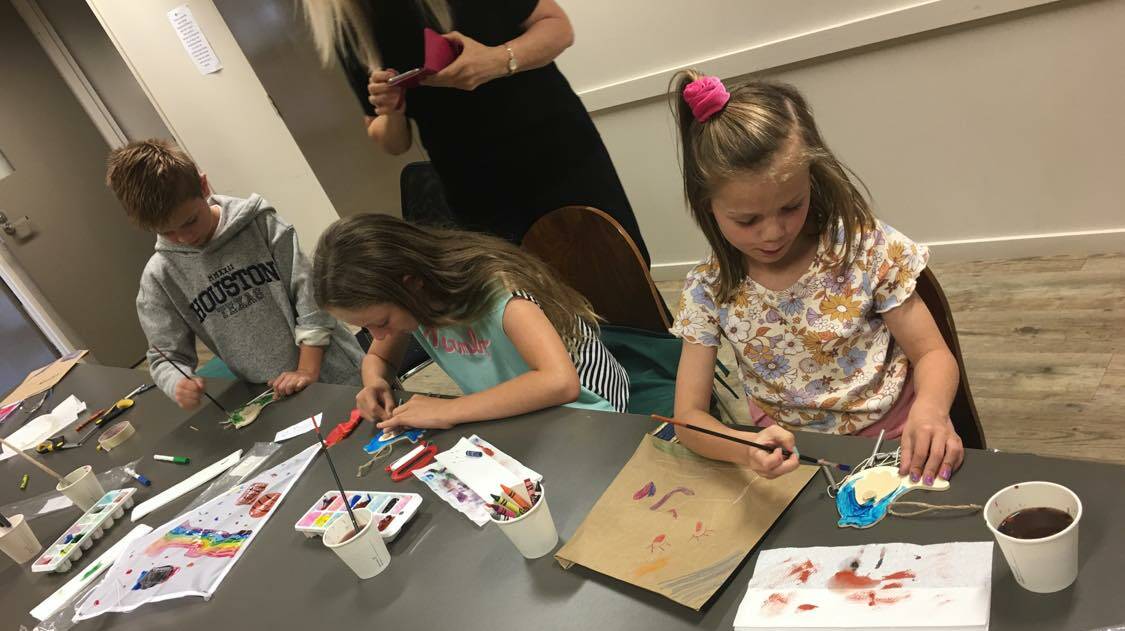 CRAFTY: Youngsters work on making their own kites at the library during the recent school holiday activity program. Photos: Supplied