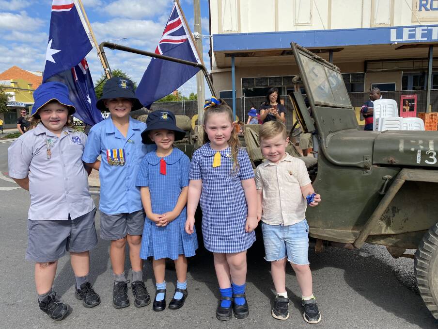 Mason Jamieson, Hudson Lashbrook, Maggie Lashbrook, Indi Jamieson and Tyler Jamieson with a war-time Jeep purchased by their great uncle, David Irvin, from the Darwin Northern Command in 1952. Picture by Talia Pattison
