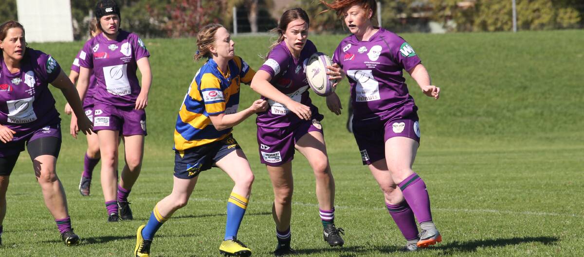 RUN: Dianas player Felicity Allen attempts to break away from her Albury opponent during a match last year at No. 1 Oval. 