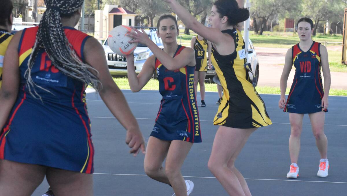 AT THE READY: Tiah Gillespie searches for a teammate during Leeton-Whitton's last outing against Wagga almost a fortnight ago. Photo: Liam Warren