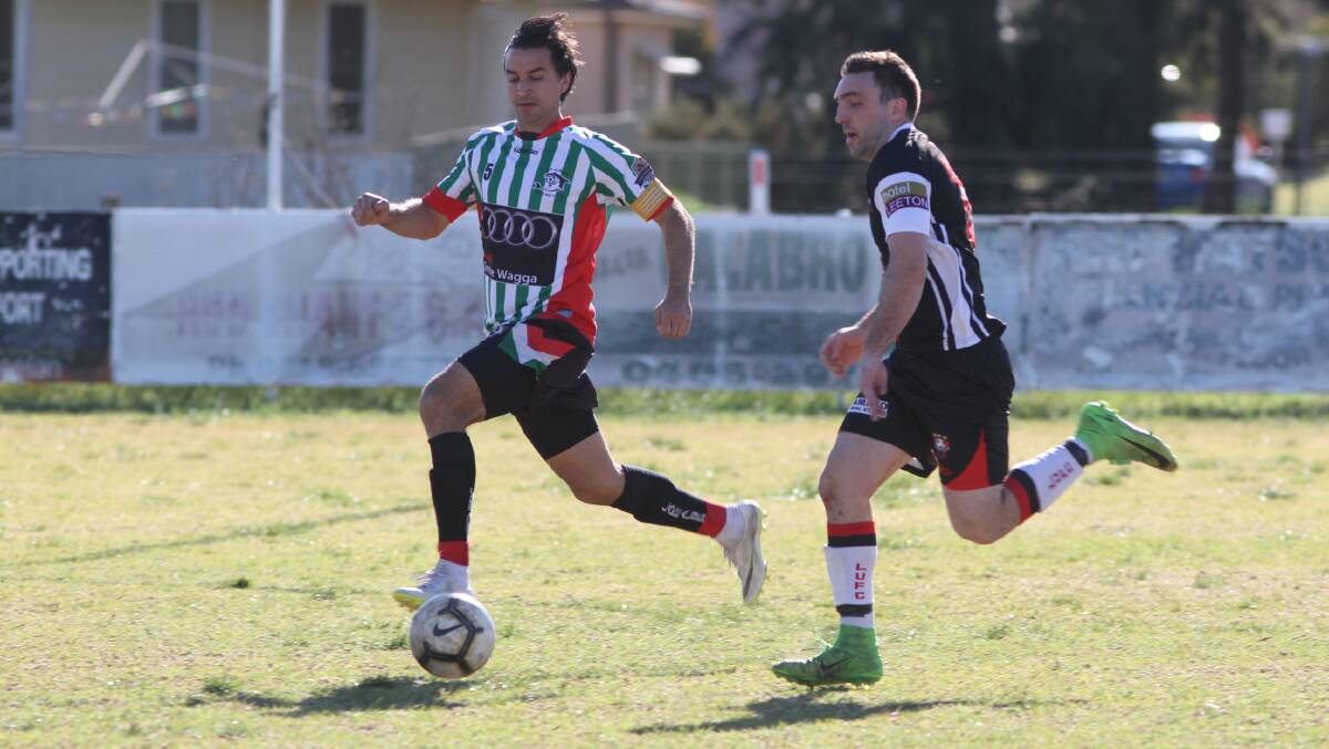 FINALS BOUND: Leeton United's Adam Raso (right) chases down the ball during his side's huge 7-1 victory on Sunday. Photo: Talia Pattison