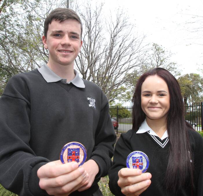 EXCELLING AT THE TOP: Leeton High School students Josh Baulch (left) won bronze in the 800-metres and Madeline Warburton silver in the javelin. Absent: Jonte Schmetzer 