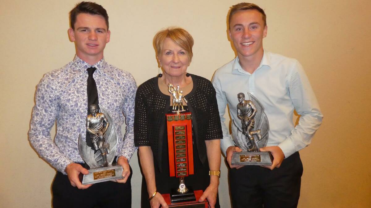 Angus Crelley (left) and Coopa Steele with Cheryl Whymark after they were announced as joint winners of the most outstanding junior football player award at the Leeton-Whitton presentation night recently. Photo: Lorraine Kefford
