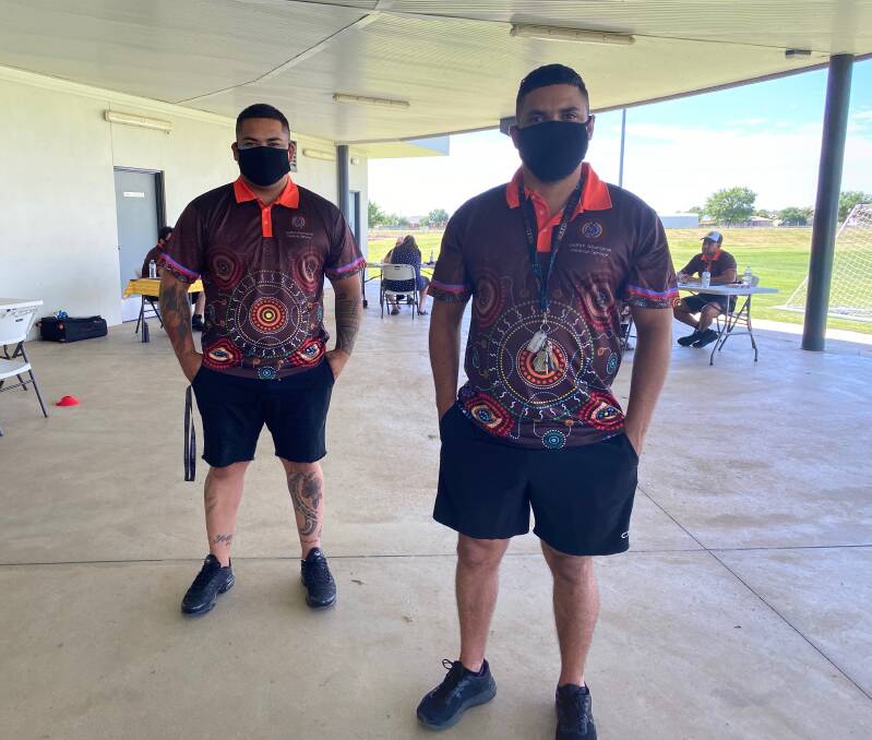 HELP: Malek Lyons (left) and Glen Buerckner helped out during the passport to better health day in Leeton. Photo: Talia Pattison