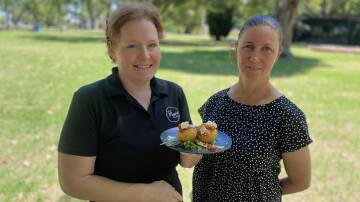 Leah Ball (left) and festival director Julie Axtill showcasing the arancini balls which will be part of the lunch. Picture by Talia Pattison