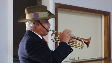 Ian Bull sounds the Last Post during Yanco's Anzac Day commemorations on Thursday. Pictures by Tessa Hamilton
