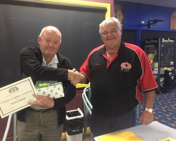 PROUD: Kevin Lehman (left) is congratulated by outgoing Leeton Vintage and Veteran Car Club president Steve Towers on receiving his life membership to the organisation. 