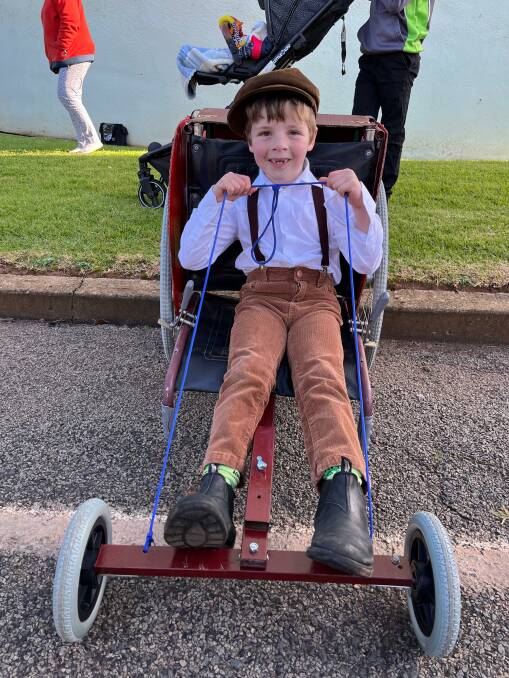 OLD-FASHIONED FUN: Benjamin Anderson Marshall had a ball racing his billy cart during the soapbox derby. Photo: Talia Pattison