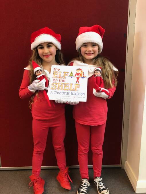DRESSED TO IMPRESS: St Joseph's Primary School students Alexis (left) and Phoebe dressed as Elf on the Shelf for Book Week. Photo: Contributed 