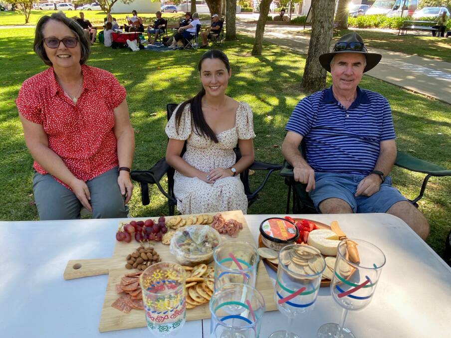 PERFECT AFTERNOON: Margaret, Emma and Scott Brindley enjoy Biggest Pink Picnic on Easter Sunday as part of the Leeton SunRice Festival. Photo: Talia Pattison