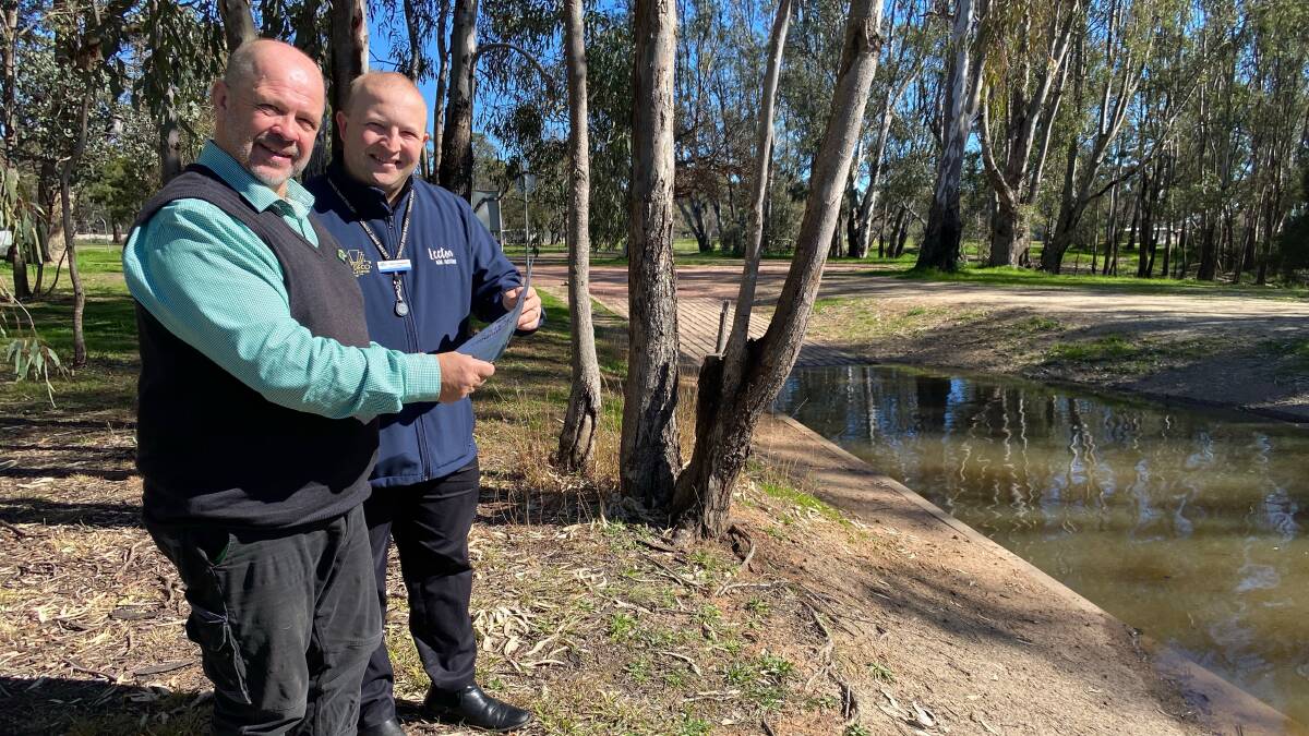 IDEAS: Leeton shire councillor George Weston (left) with council's Brent Lawrence looking over draft plans at Gogeldrie Weir. Photo: Talia Pattison
