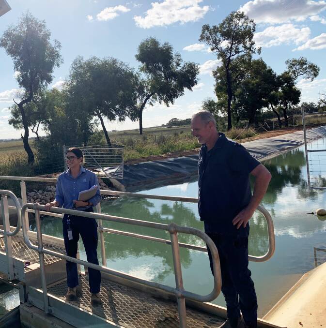 ASSESS: Murrumbidgee Irrigation engagement officer Hayley Foscarini discusses the upcoming works with irrigator Jeff Emery. Photo: Contributed 