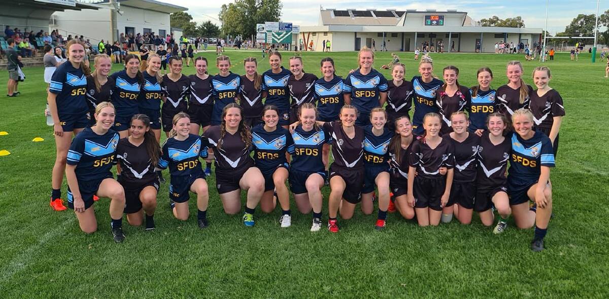 OFF FIELD: Leeton High School and St Francis College after the league tag match on Wednesday. Photo: St Francis College