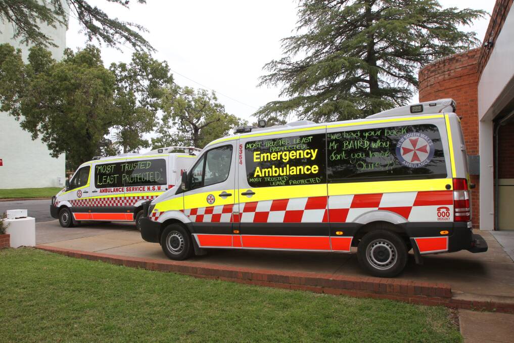 TWO of the Leeton ambulances with slogans that read “most trusted, least protected” and “we had your back Mr Baird, why don’t you have ours”. 