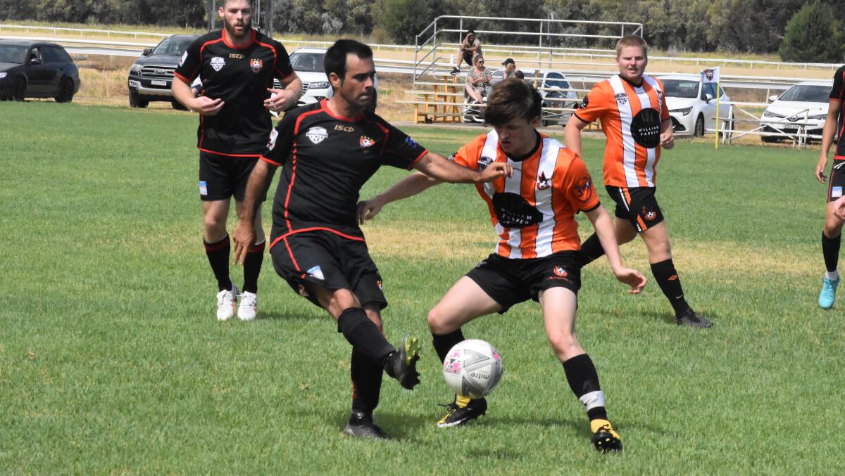 Leeton United's Ricky Massola gets the ball moving during his team's round one Riverina Cup game against Wagga United. Picture by Liam Warren