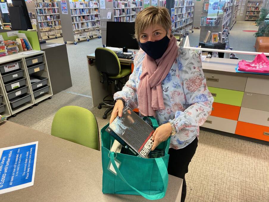 ALL SET: Leeton library's Rachel Cody prepares one of the home delivery bags. Photo: Talia Pattison