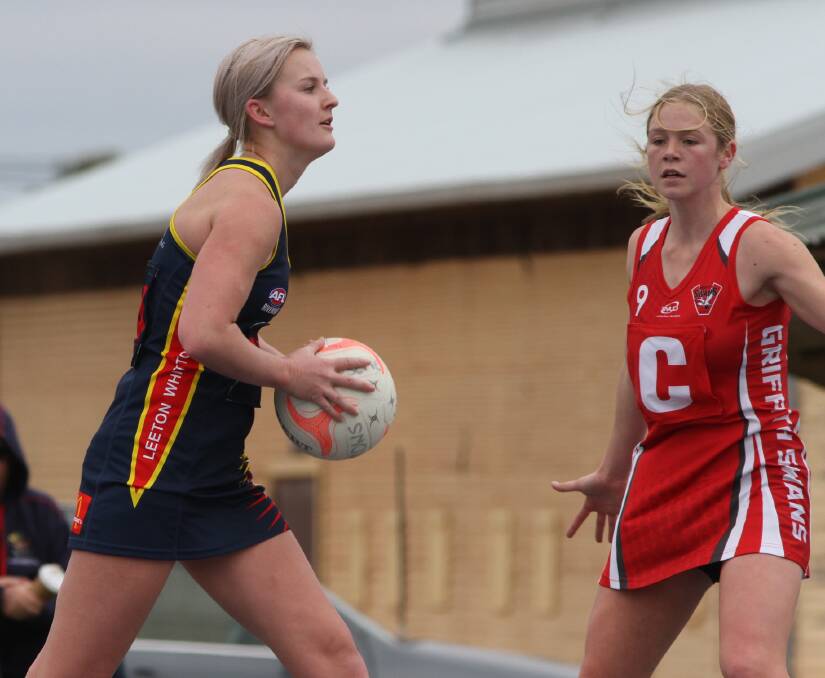 LOOKING FOR OPTIONS: Leeton-Whitton's Maddy Clyne searches for a team mate during Saturday's loss to Griffith. Photo: Liam Warren