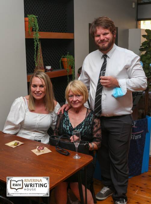 WELL DONE: Poet Ben Smith (right) with his sister Kaylah and mother Julie, celebrating his first book launch. Photo: Supplied