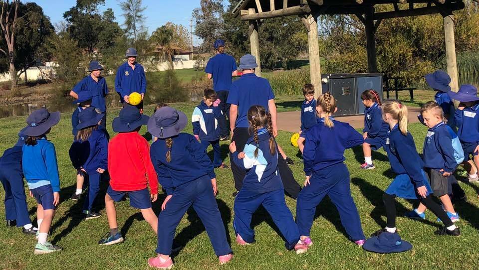 WORK TOGETHER: Yanco Agricultural High School students have been leading sporting sessions and activities with their younger counterparts at Yanco Public School. Photo: Contributed