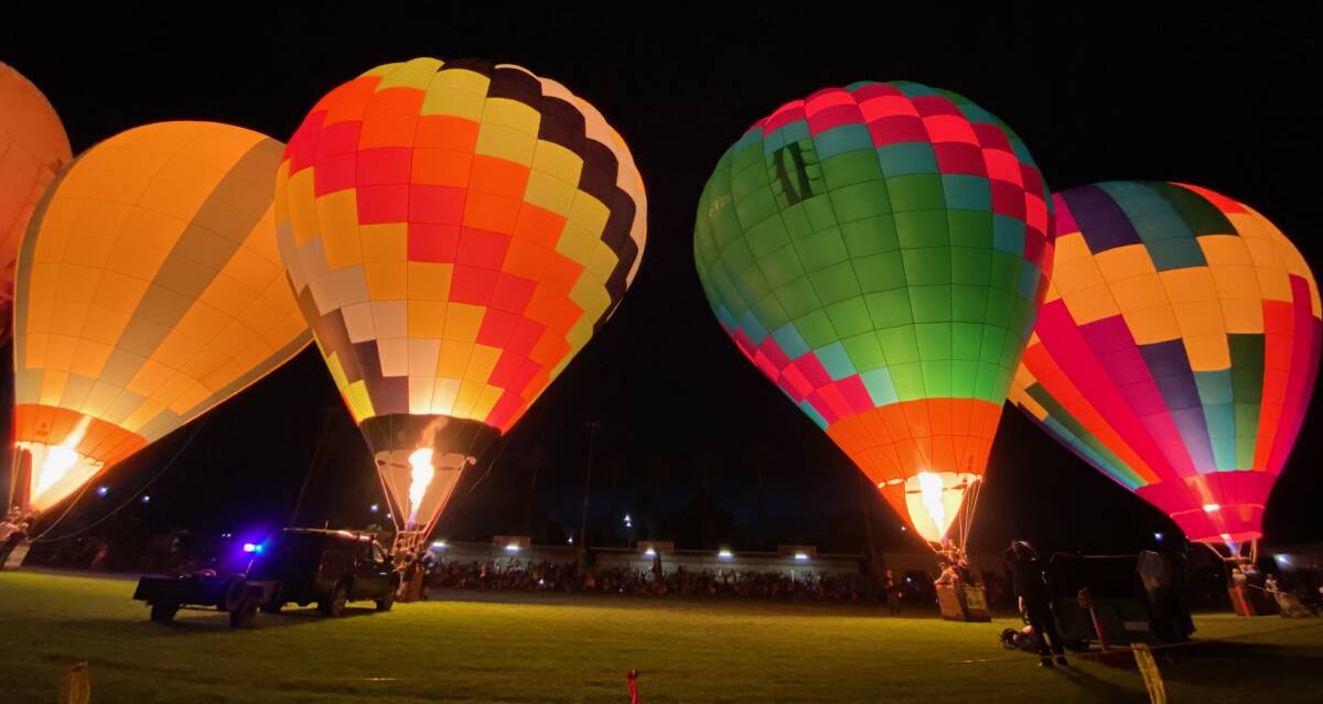 STUNNING: The Leeton SunRice Festival balloon glow was a treat for residents and visitors at the town ovals on Easter Sunday. Photo: Talia Pattison