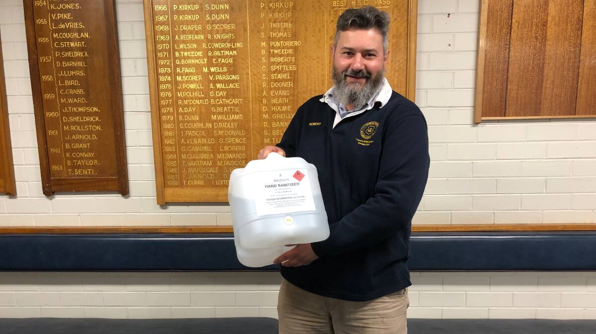 CLEAN PRACTICE: Robert Bruno from Toorak Winery with the donation of hand sanitiser. Photo: Talia Pattison