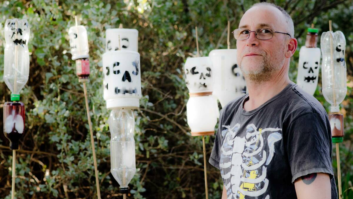 Leeton artist Jason Richardson with his spooky wind organs, a project repurposed for Halloween. Picture supplied 