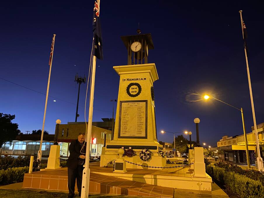 SOLO: Leeton RSL Sub-branch president Peter Williams raises the Australian flag during a dawn service that had no crowds in attendance in 2020. Photo: Talia Pattison