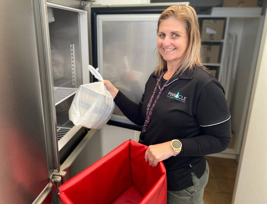 NEED: Pinnacle Community Services co-ordinator Tanya Lewis packs some of the Meals on Wheels packages for her clients. Photo: Talia Pattison 