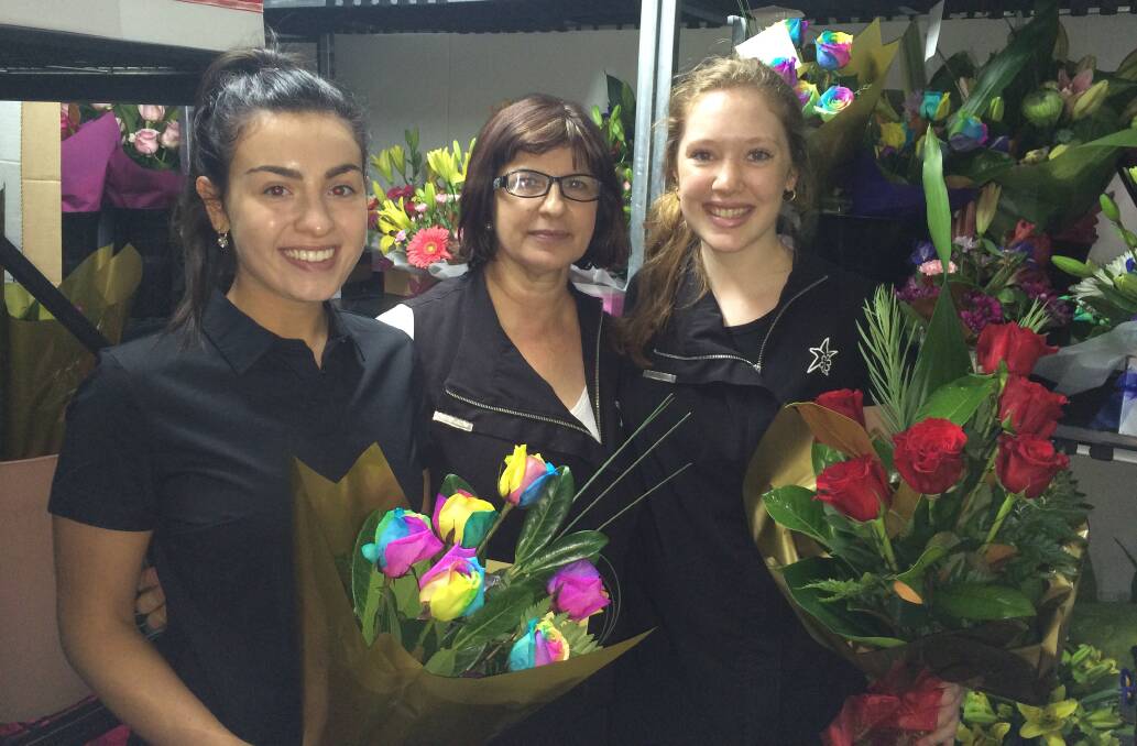 BUSY: Theresa Nardi, Terese Ierano and Hannah Boardman prepare for the busiest day of the year on every florists' calendar. 