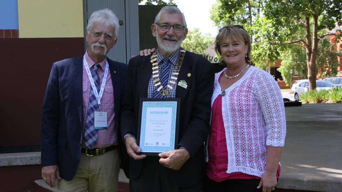 Leeton shire mayor Paul Maytom is congratulated by 2020 Leeton Australia Day ambassador Gareth McCray (left) and Leeton Shire Council general manager Jackie Kruger (right). Photo: Talia Pattison