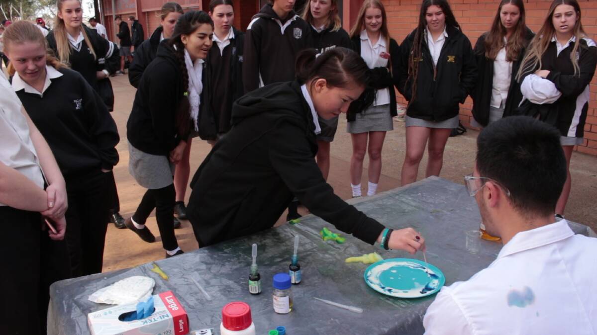 EXPERIENCE: Leeton High School students try some of the hands-on activities Macquarie University brought to town back in 2018. Photo: Contributed 