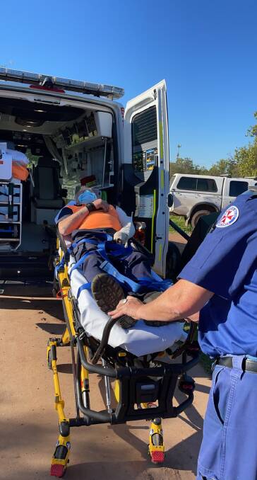 Whitton resident Allan Dart prepares to be transported via ambulance to Griffith Base Hospital following the brown snake bite on Father's Day before later being airlifted to St Vincent's Hospital in Sydney. Picture supplied by Allanna Dart