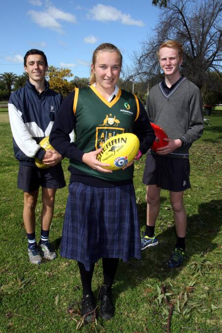 St Francis College students (back) Isaac Williams and Sam Hopper played in the under 15s, while (front) Mary Sandral was part of the under 16s girls side and was selected in the All Australian team.