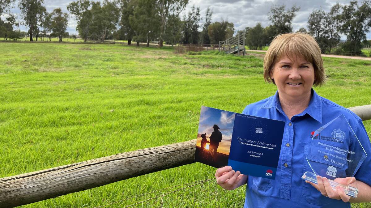 WELL DONE: Val Draper with the award at her home in Leeton. Photo: Talia Pattison