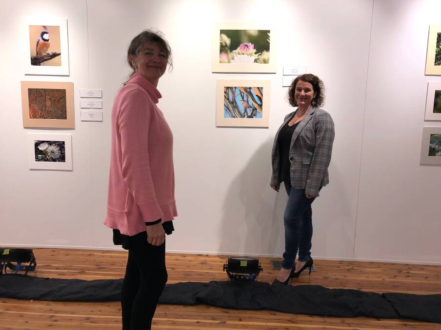 SUPPORT: Aanya Whitehead from Western Riverina Arts (left) and Suesann Vos from Leeton Shire Council viewing the photography exhibition. 