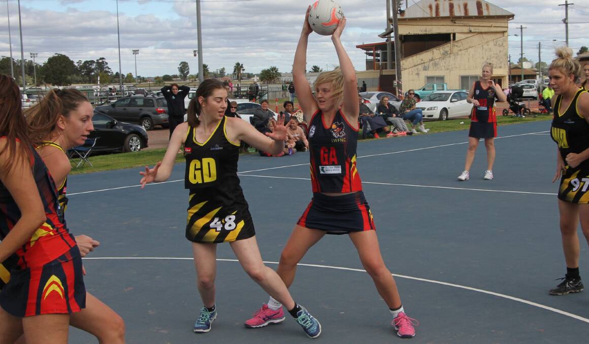 WHERE TO NOW: Leeton-Whitton's Maddy Clyne looks to off load this pass in the shooter's circle during an earlier match this season. Photo: Ron Arel 