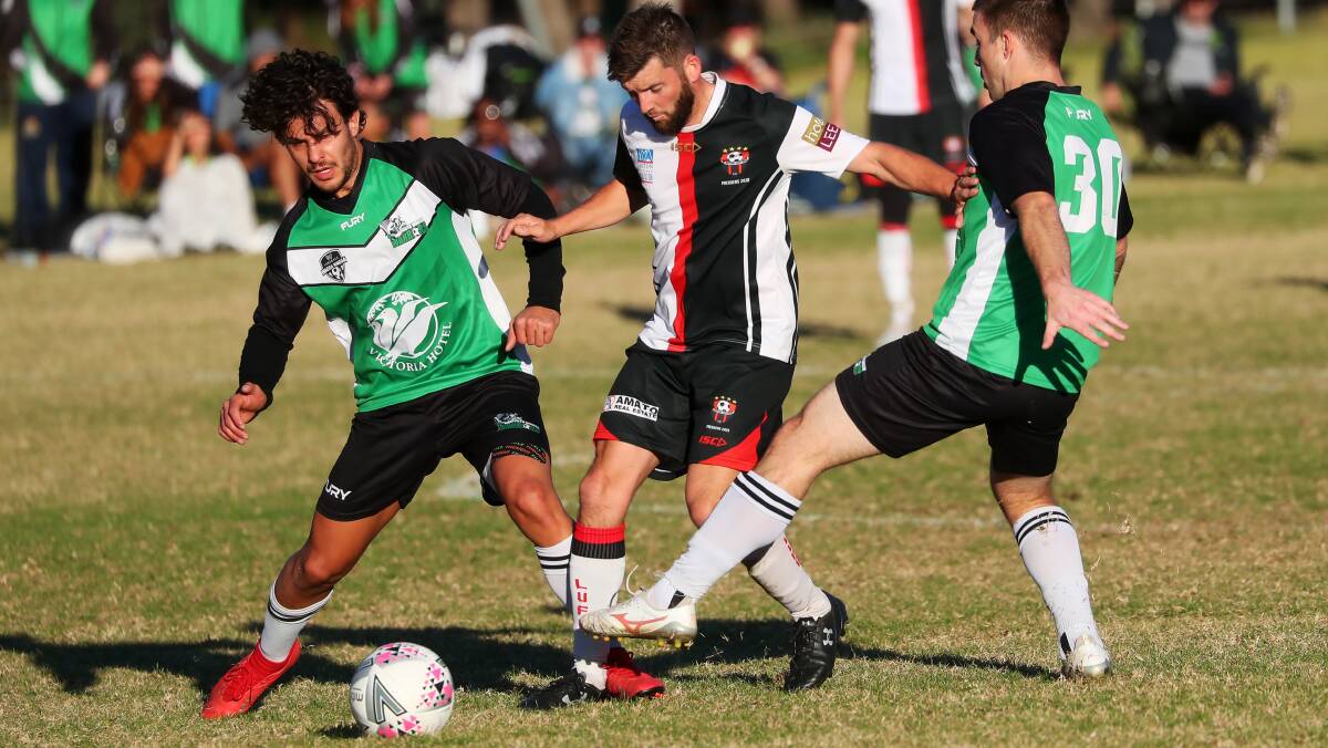 NEXT CHALLENGE: Leeton United's Stuart Smeeth attempts to gain possession during a recent match up. United will take on Cootamundra at home on Sunday. Photo: Emma Hillier