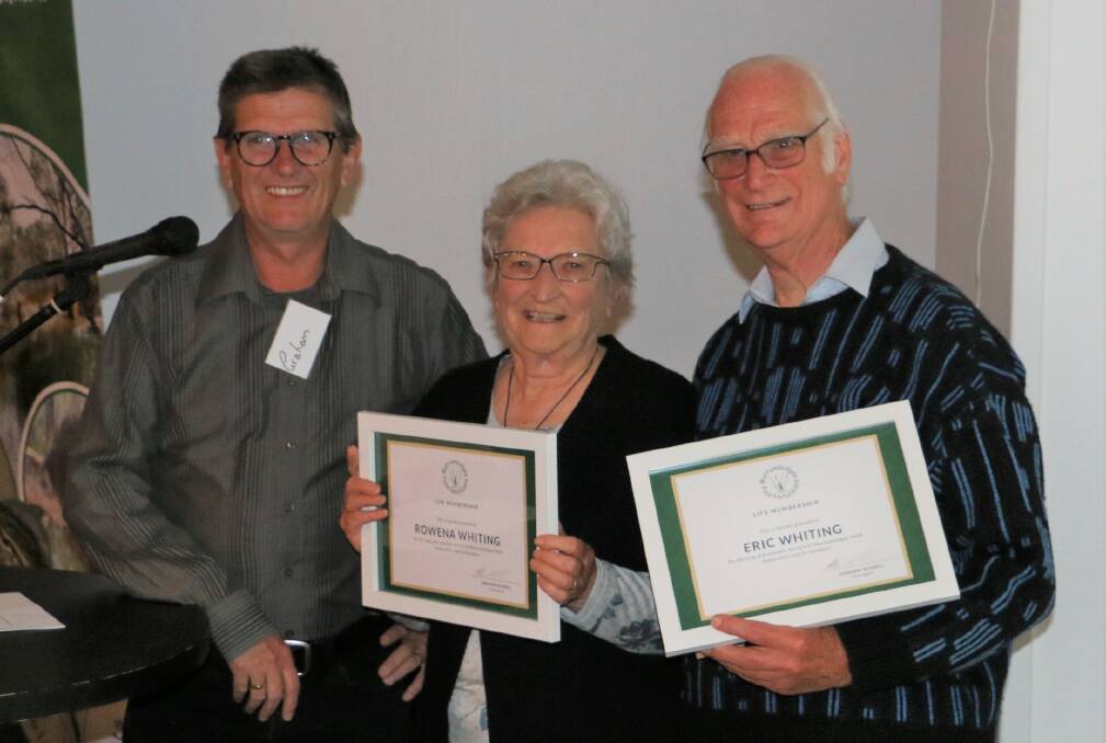 CONGRATULATIONS: Grahan Russell presents Rowena and Eric Whiting with life membership of the Murrumbidgee Field Naturalists organisation at the recent anniversary celebrations. Photo: Contributed