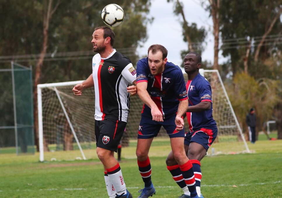 DISAPPOINTING END: Leeton United's Michael Di Lorenzo makes contact with the ball during Sunday's afternoon's loss to his Henwood Park. Photos: The Daily Advertiser 