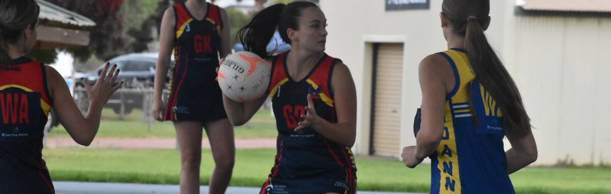 GAME ON: Leeton-Whitton A grade coach Katie Graham prepares to offload a pass during a recent home game. Photo: Liam Warren