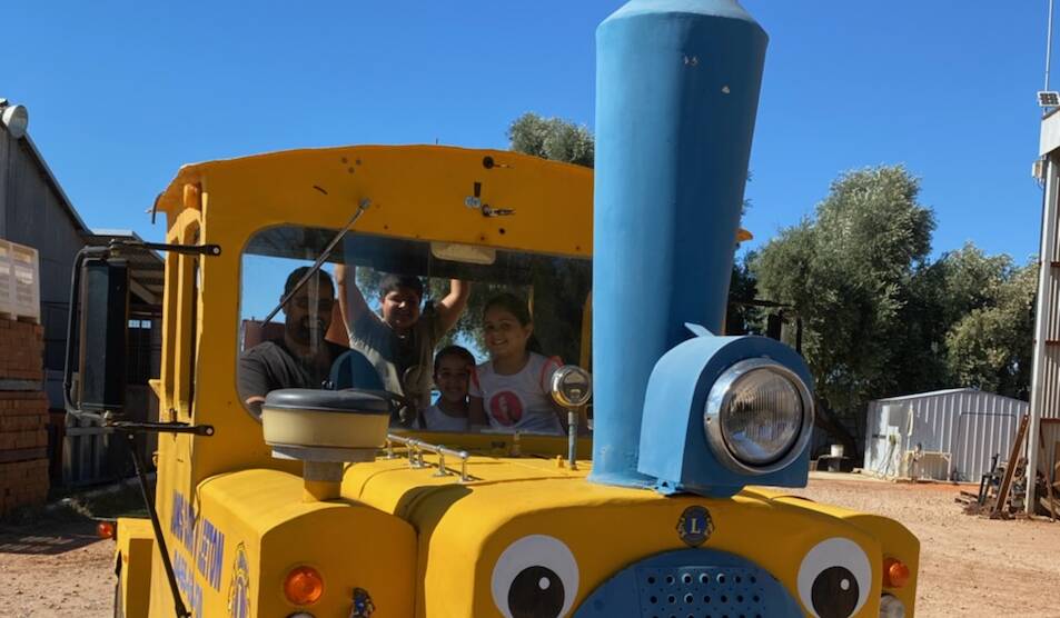 FINAL JOURNEY: Leeton Lions Club president Frank Pirrottina with his children Sam, Ashleigh and Abby on the old train before it made its way to the Yanco Powerhouse Museum. 