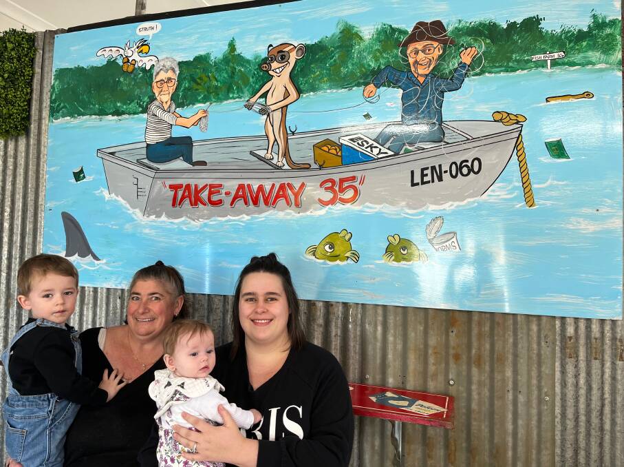 FAMILY AFFAIR: Reign Meyers, 2, Sharon Blackett, Lily Meyers, four months, and Ashley Meyers with the Takeaway 35 signage which has special meaning to the family. Photo: Talia Pattison