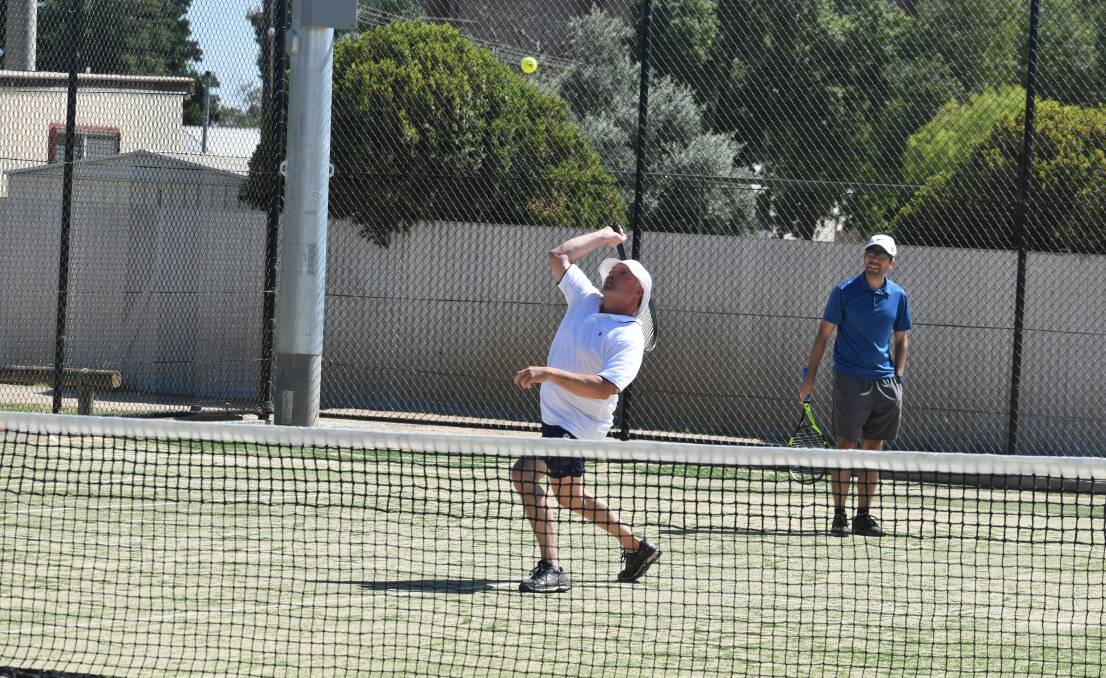 WHACK: Brad Hornery prepares to thump this ball back over the net during the Barellan Masters Games on the weekend. Photo: Liam Warren
