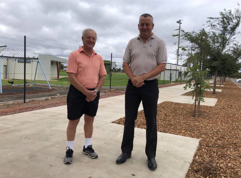 PROGRESS: Leeton sporting walk of fame committee members Barry Greatz and Tony Reneker where the path has been constructed near the town ovals. Photo: Talia Pattison